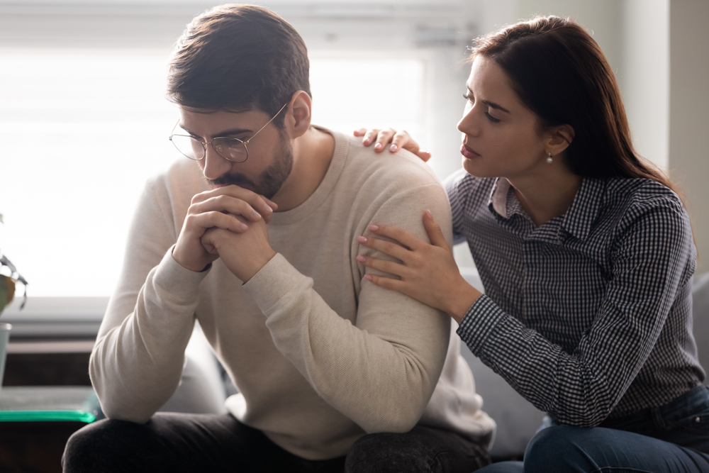 Attractive,Wife,Comforting,Husband,Embrace,And,Showing,Support.,Woman,Upset How to Maintain a Positive Relationship Post-Divorce